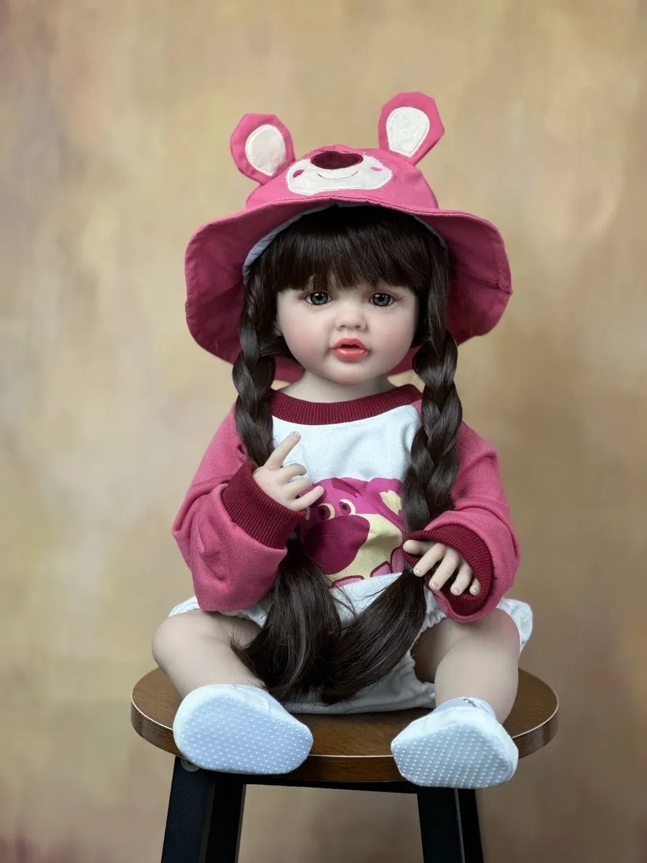 Realistic newborn Reborn Doll silicone girl in a pink outfit and hat for lifelike role play, display, and birthday presents.