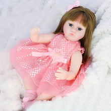 Doll in a pink dress with a bow on a white fluffy background