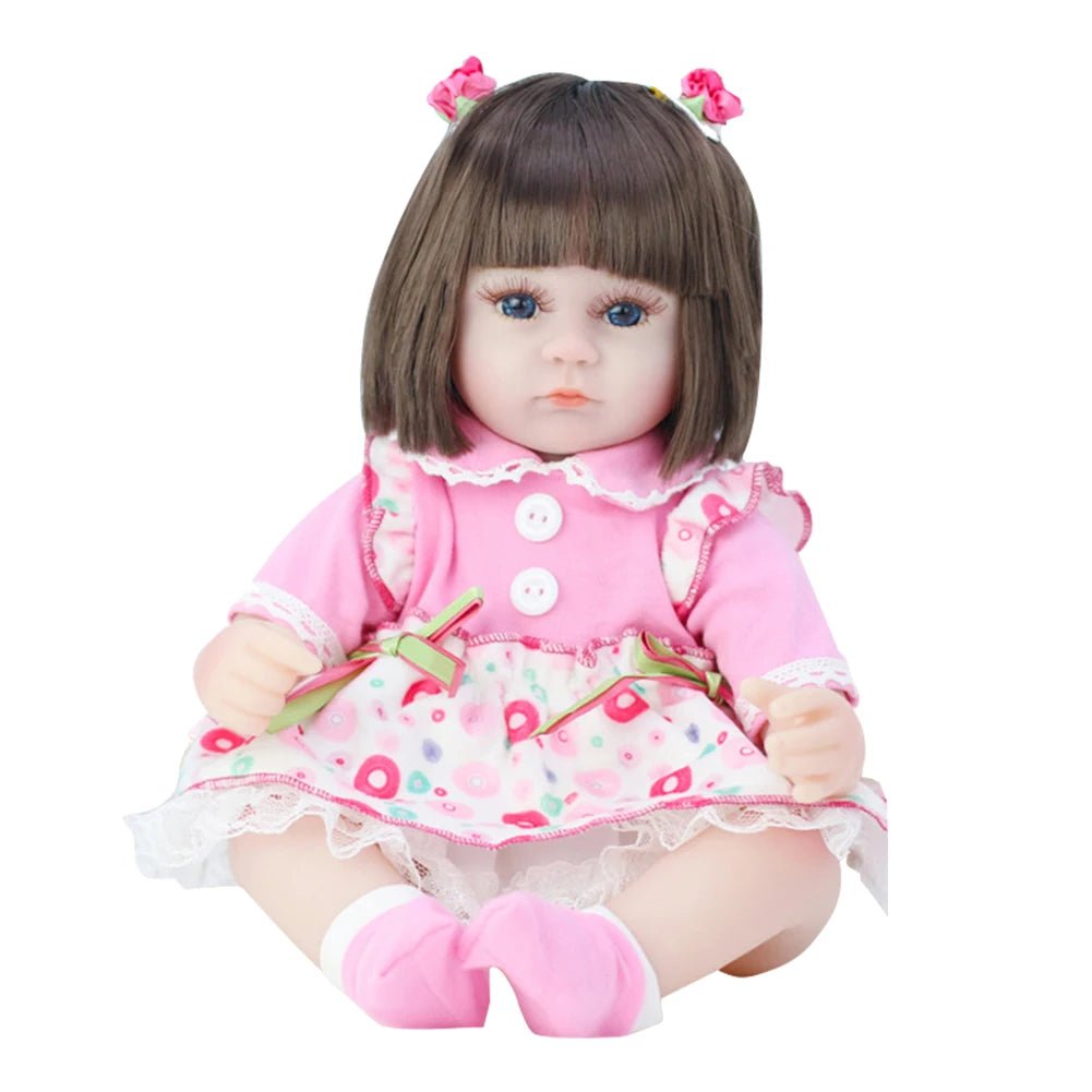Doll with brown hair and a pink outfit 