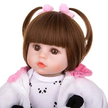 Reborn baby doll with brown pigtails in a panda outfit for lifelike dress-up play and doll collecting.