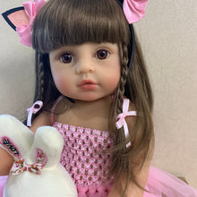 Reborn bath toy doll in pink princess styling with braided hair and white plush for bathing routines, play, and gifting.