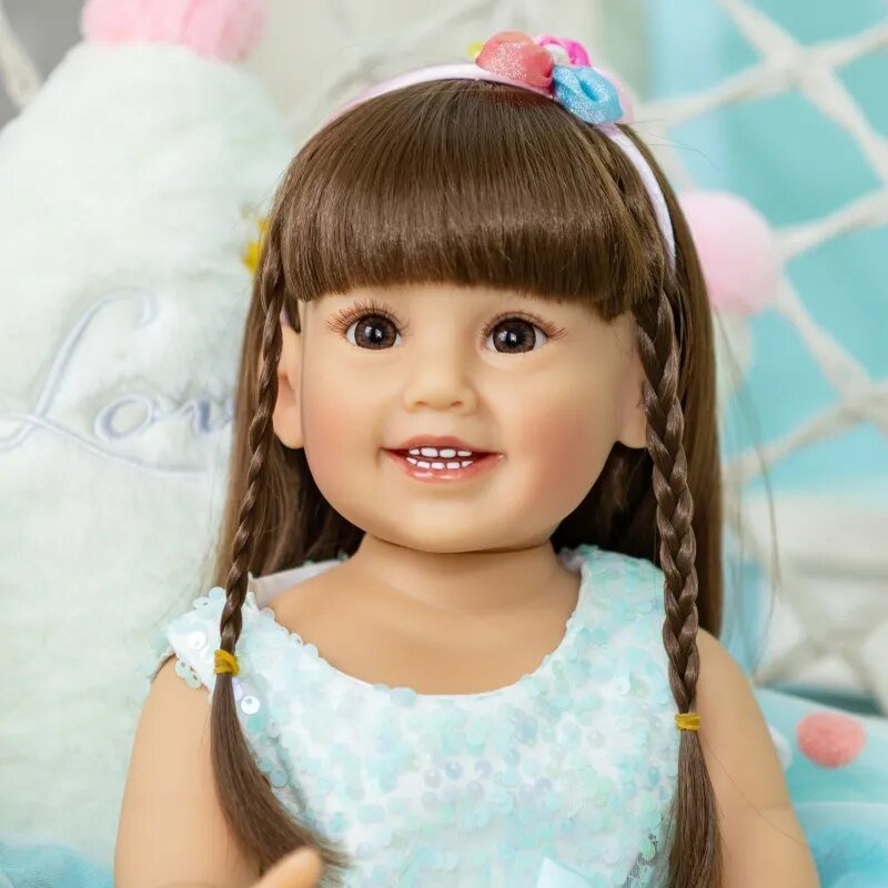 Reborn Toddler silicone doll in a blue skirt with lifelike fashion styling, seated for display, cuddling, and keepsake collecting.