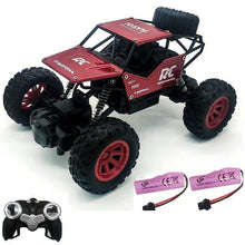 Red and black RC monster truck race pack with twin batteries and remote for competitive back-to-back racing.