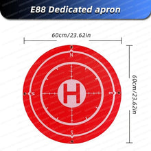 Red drone landing mat with measurements marking a safe E88 Pro takeoff zone for outdoor flying sessions.
