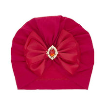 Red gemstone bow baby turban headband shown again for checking detail before festive dressing and gifting.