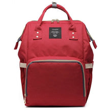 Red maternity diaper bag daily use view for carrying baby essentials around town.