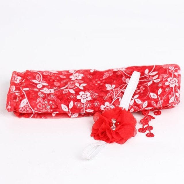 Red newborn flower headband prop from an alternate view for festive baby photography and portraits.