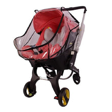 Red baby stroller fitted with a transparent windproof PVC rain cover for rainy day outings.