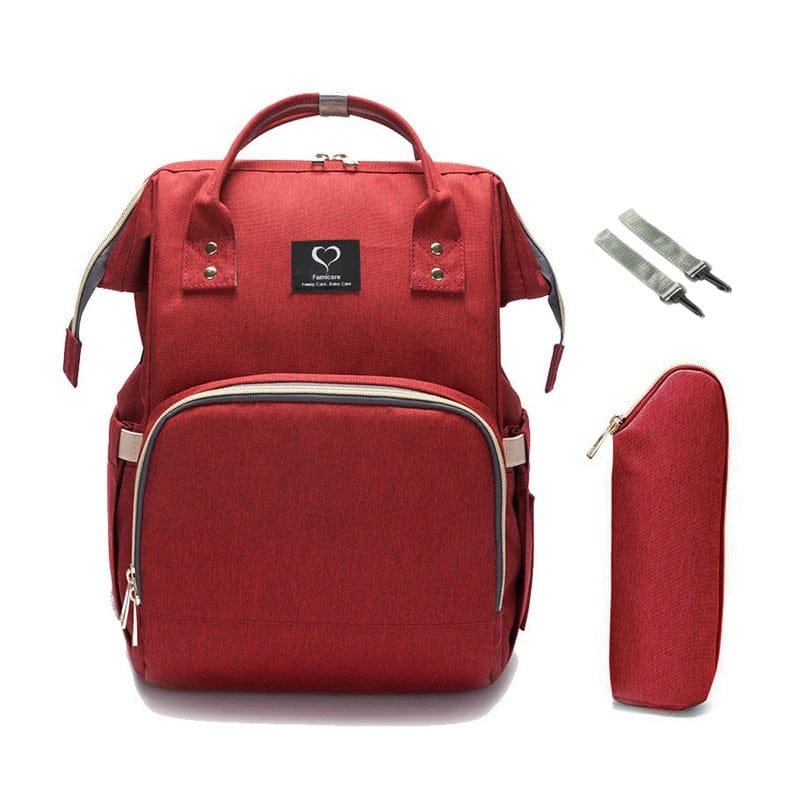 Red waterproof maternity nursing diaper backpack with pouch for storing feeding bottles and nappy supplies on the go.
