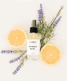 Refresh Mist facial spray bottle styled with lemon and lavender for cooling hydration and daily skincare refreshment.