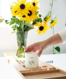 Remembrance Healing Candle jar placed on a wooden tray for sympathy gifting, memorial keepsakes, and calming home rituals.