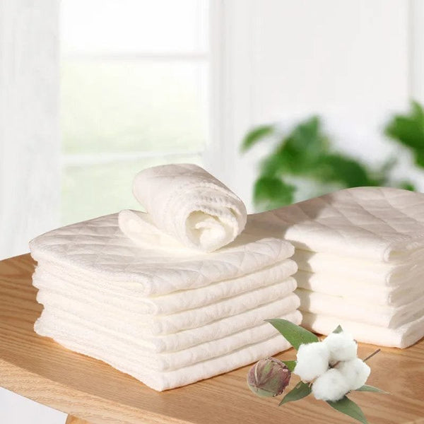 Reusable 3-layer microfiber baby cloth diaper liners stacked for nappy changes, daily diapering, and washable diaper use.