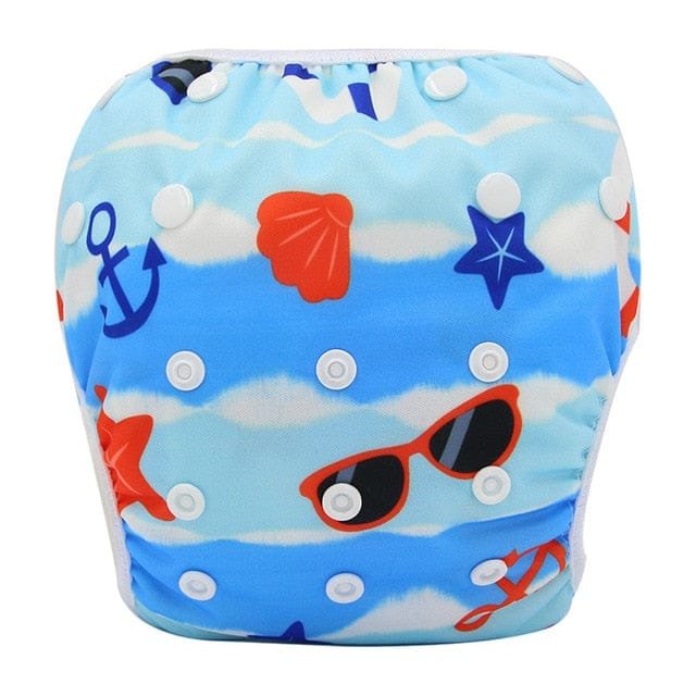 Beach print reusable baby swim diaper, a waterproof toddler swim pant for seaside trips and summer water play.