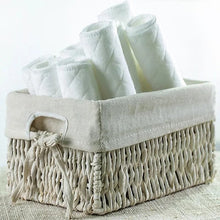 Reusable cloth diaper liners kept in a nursery basket for tidy storage, quick nappy changes, and daily baby care.
