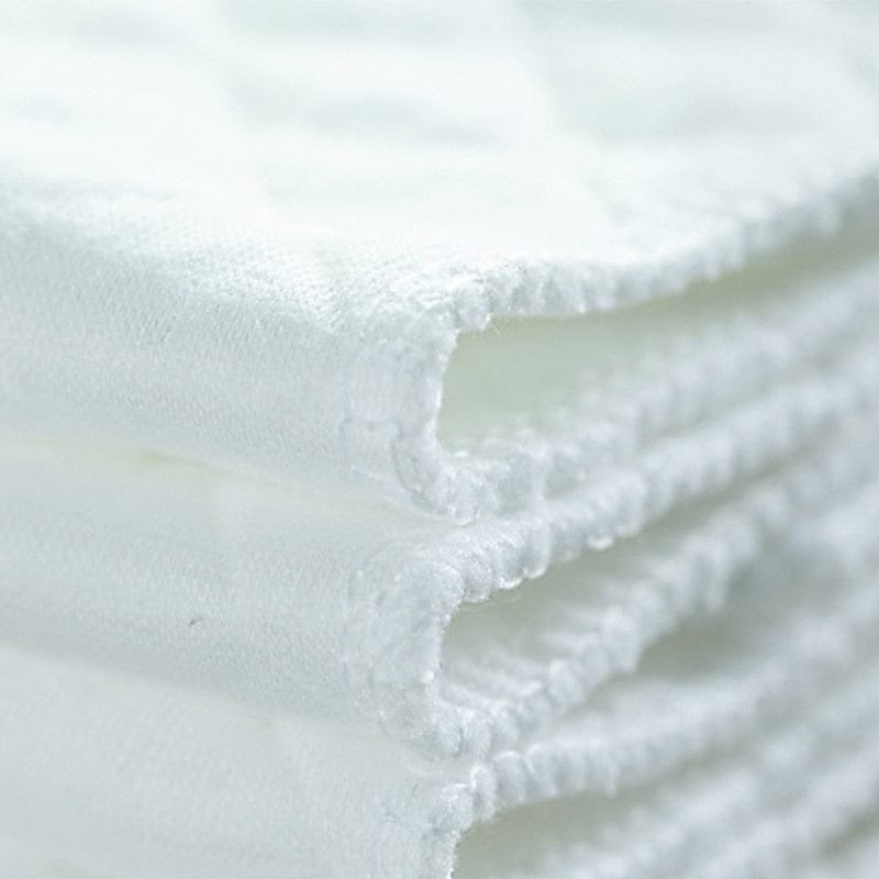 Reusable cloth diaper soft cotton lining for gentle comfort against newborn skin during daily wear.