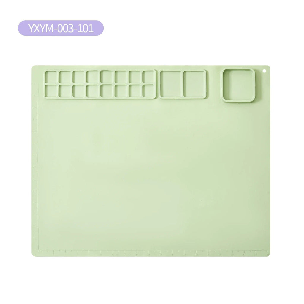 Light green plastic mat with cut-out sections.