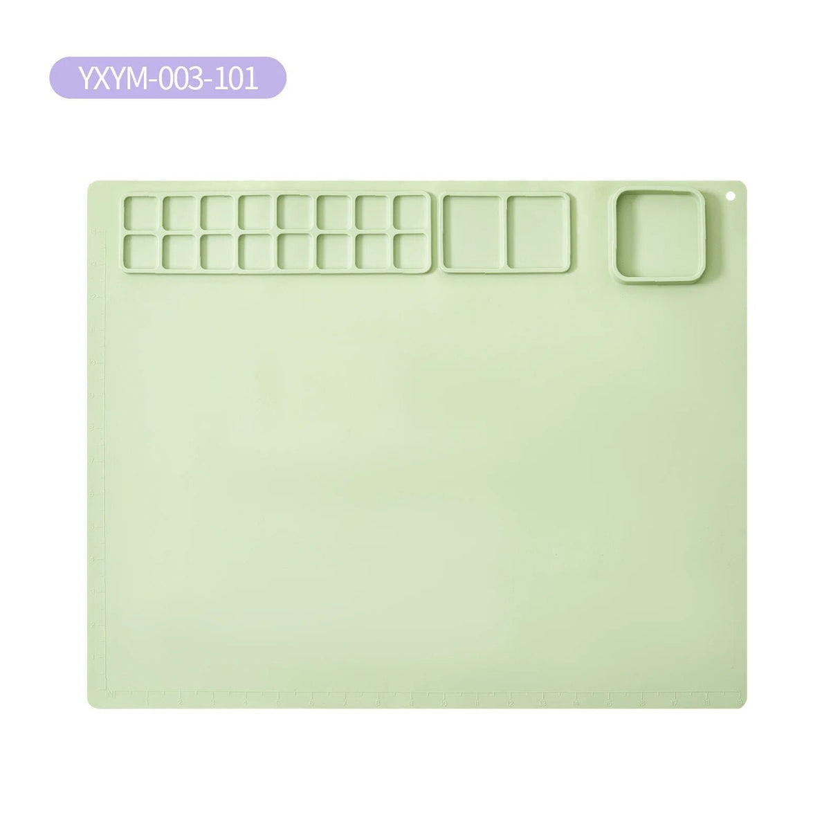 Light green plastic mat with cut-out sections.