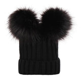 Black knit beanie with large black fur pom-poms