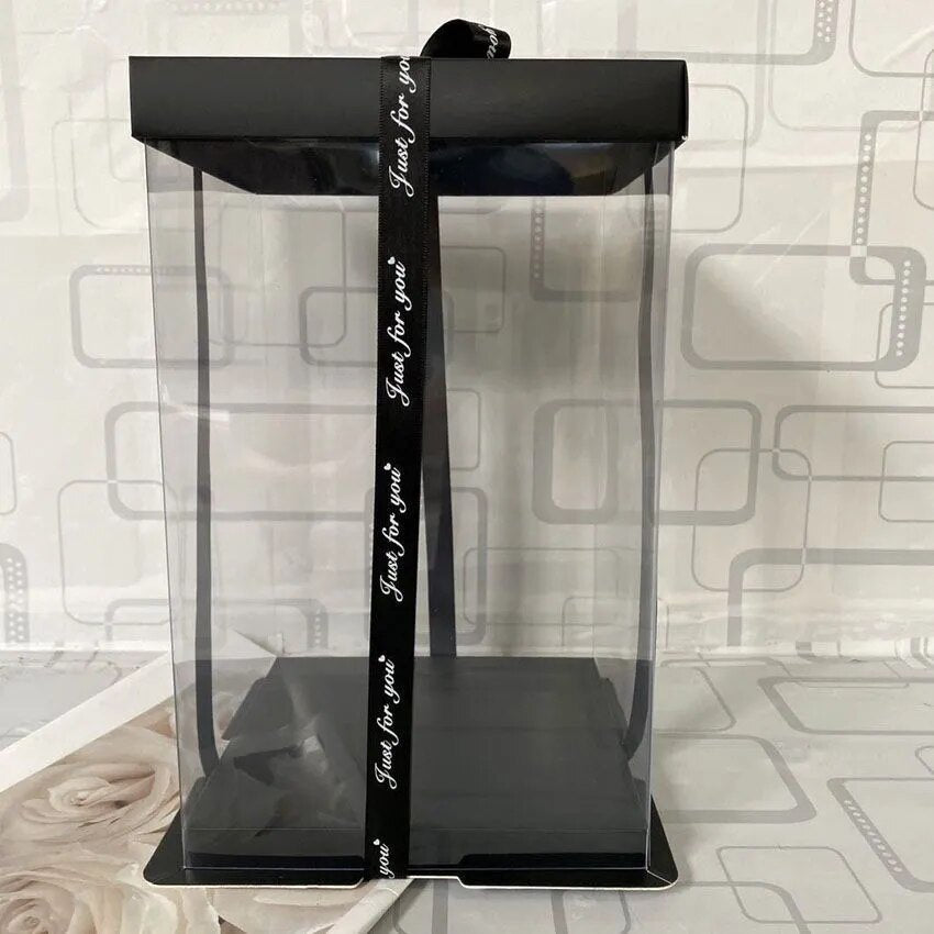 Black and clear gift box with a black ribbon.