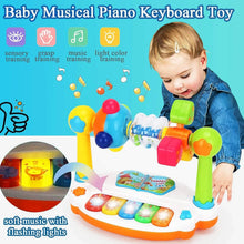 Child reaching for a piano keyboard toy with icons for sensory, grasp, music and light color training