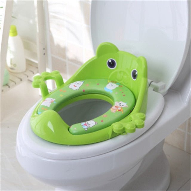 Green frog-shaped children's potty seat on a toilet