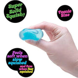 Hand holding a blue squishy toy with descriptive text around it.