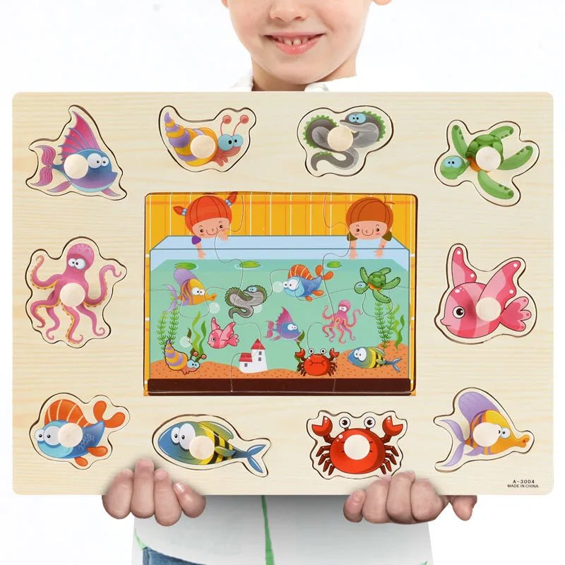 Child holding a Montessori wooden sea animal puzzle for sensory education and ocean-themed learning play.