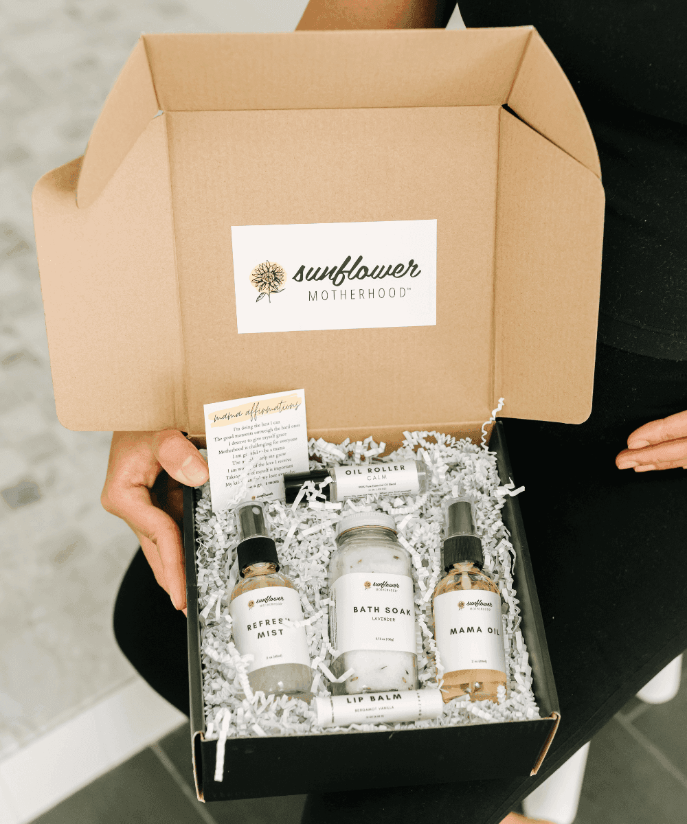 Box of skincare products with 'sunflower motherhood' branding.