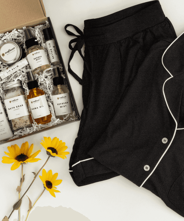 Self Care Night Bundle with a black pajama set and bath products for relaxing evenings, unwinding at home, and restful bedtime routines.
