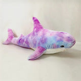 Purple based Colorful shark-shaped plush toy.
