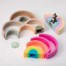 BPA-Free Silicone Baby Blocks rainbow arch pieces laid flat for size sorting, nesting practice, and quiet play.