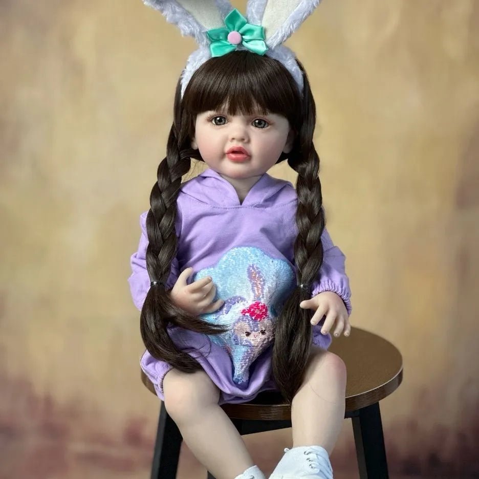 Silicone Baby Reborn Doll newborn girl in a bunny-ear purple outfit for imaginative play, cuddling, and gifts for kids.