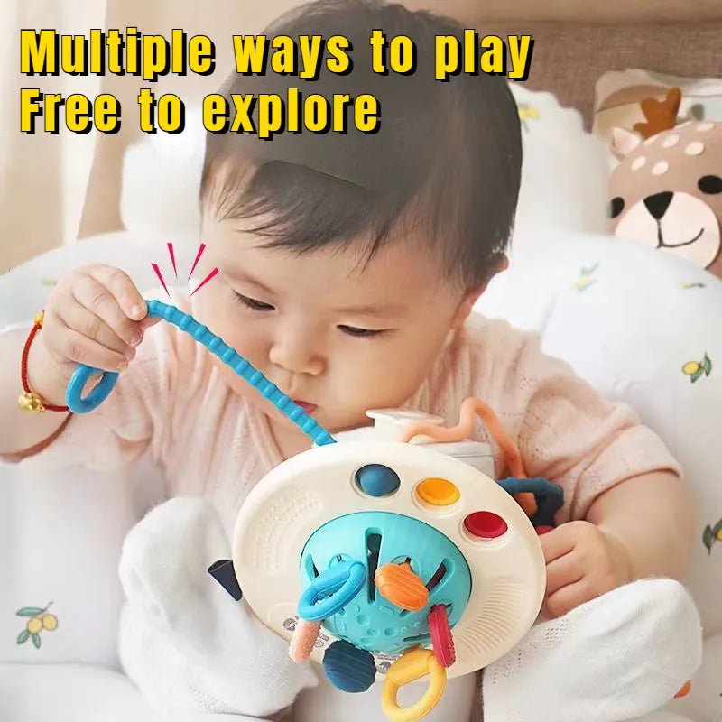 Child playing with a colorful toy, surrounded by soft bedding and plush toys.