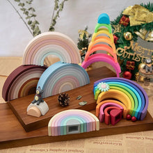 Rainbow Silicone Baby Blocks stacked on a wooden stand for nursery display, balance play, and fine motor practice.