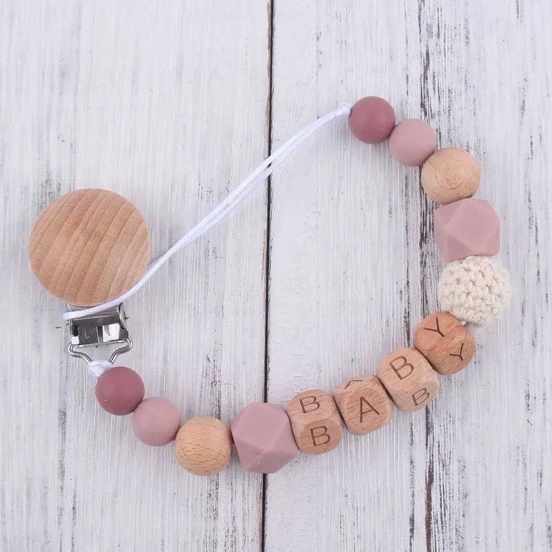 Silicone teether and pacifier clip set, a baby travel essential for keeping soothers clean during trips out.