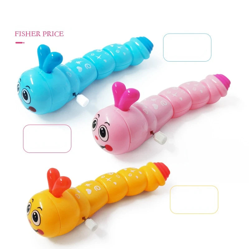 Blue, pink and orange smiling wind-up caterpillar toys on a white background, second view