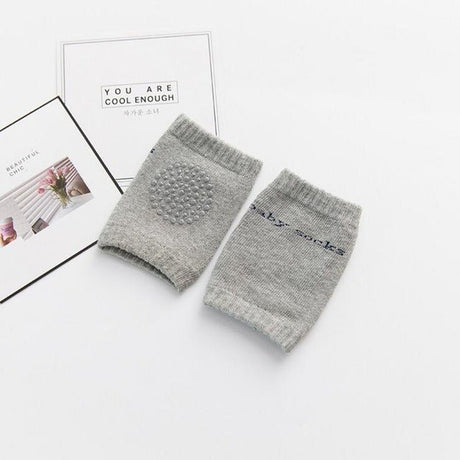 Gray baby booties with 'baby shoes' text