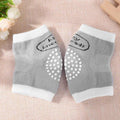 Pair of gray knee pads with white polka dots.
