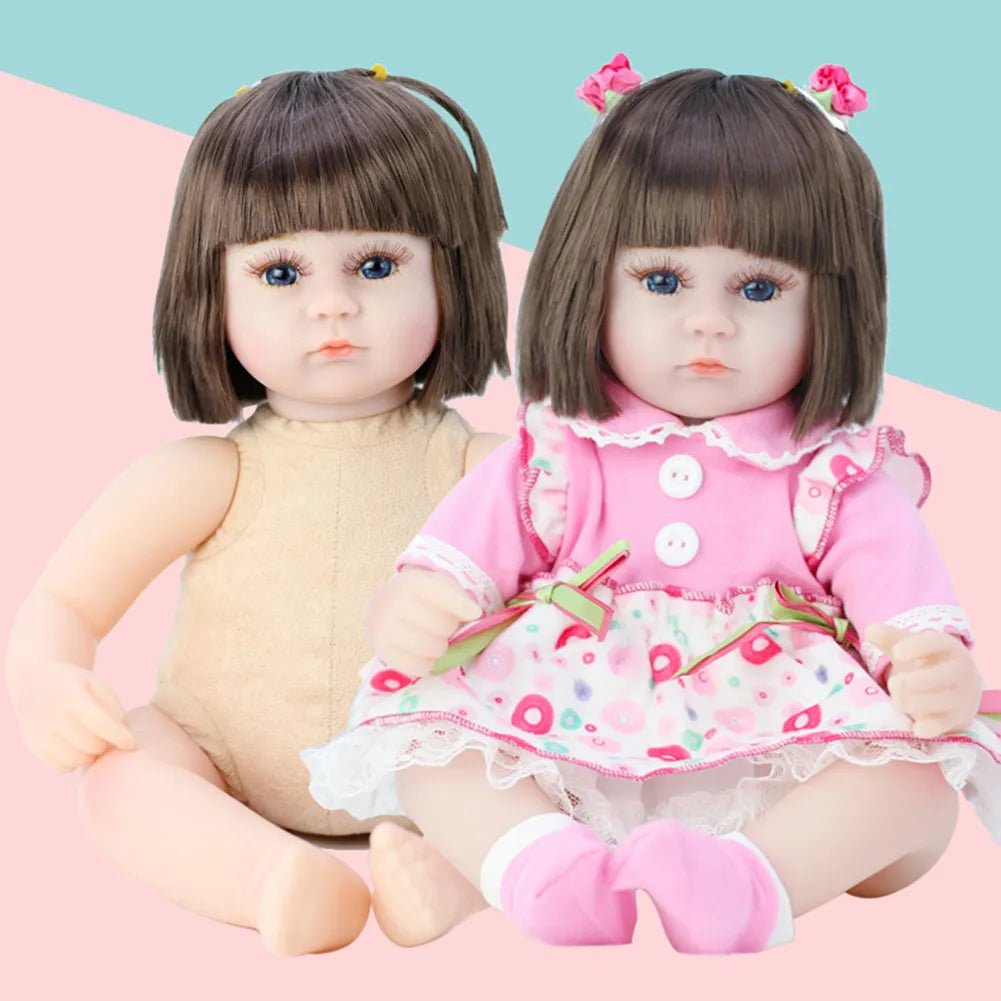 Two dolls, one in a beige outfit and the other in a pink dress with floral patterns, sitting on a pink surface with a light blue background.