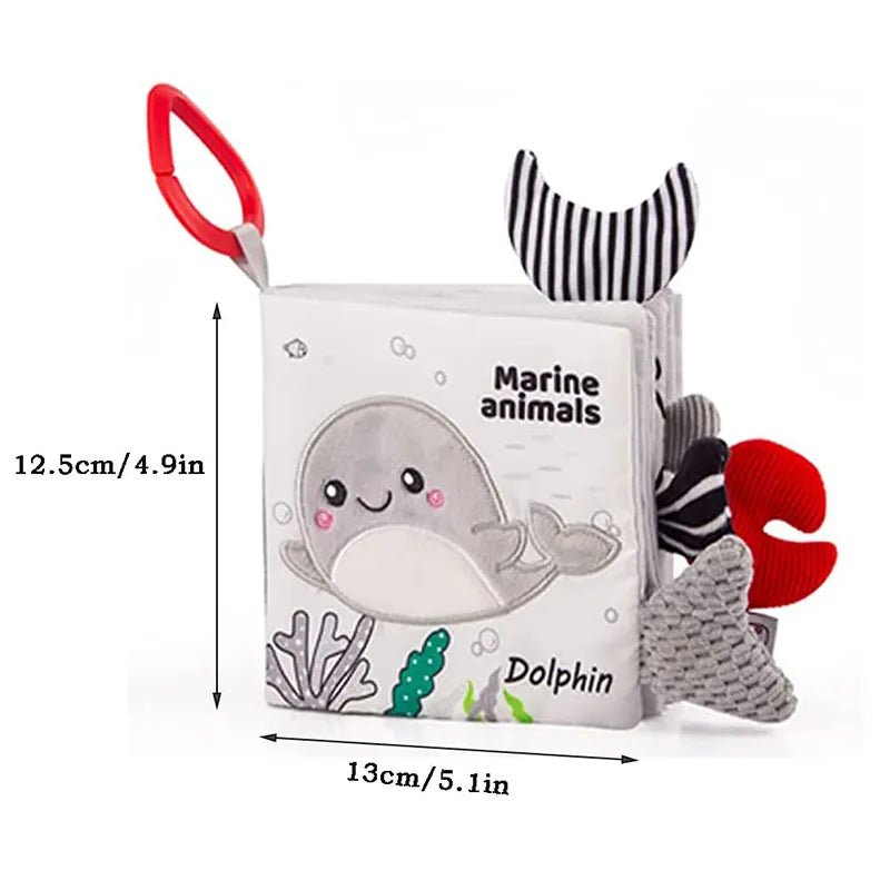 Soft cloth baby book with marine animal pages and measurements for sensory learning at 0-12 months.