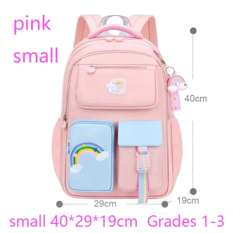 Pink backpack with rainbow design and measurements.
