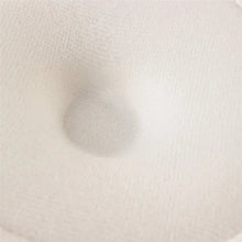 Close-up of the beige soft cotton nursing pad fabric, a washable absorbent layer for comfortable nursing wear.