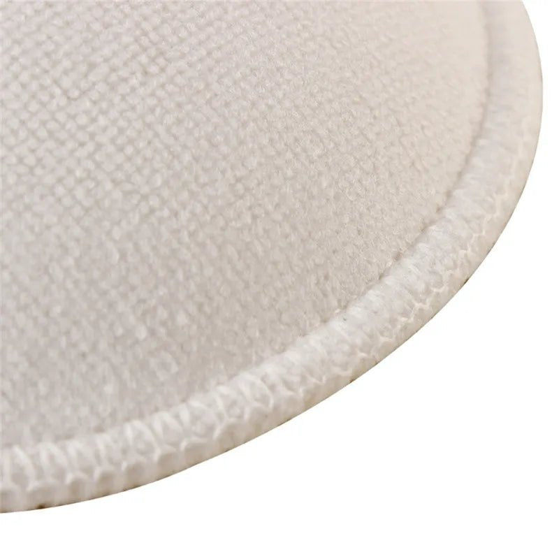 Close-up of the soft cotton nursing pad texture, showing the absorbent washable material for daily breastfeeding use.