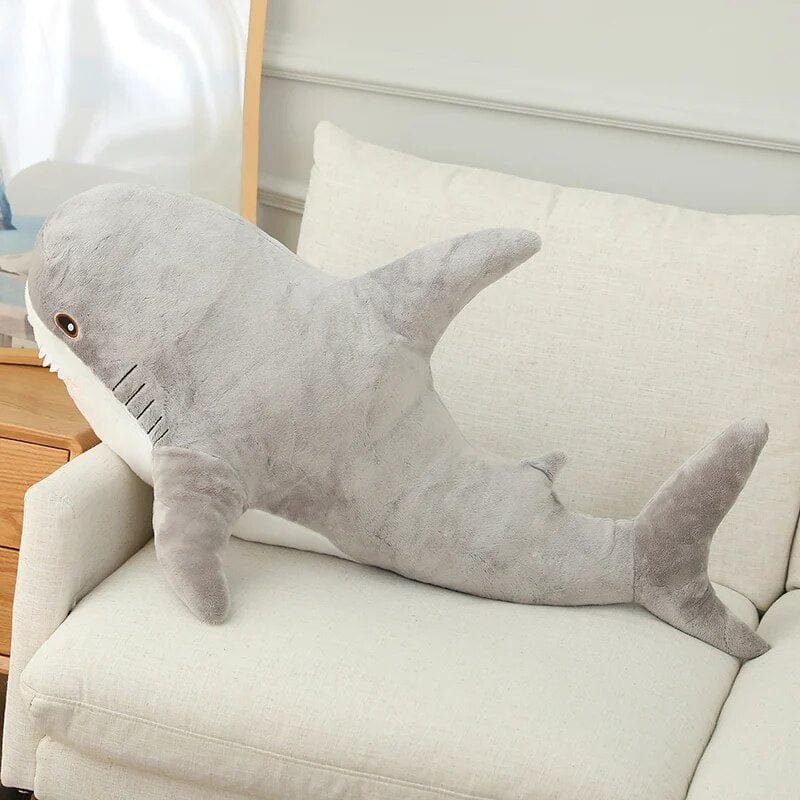 Gray colored shark-shaped pillow.