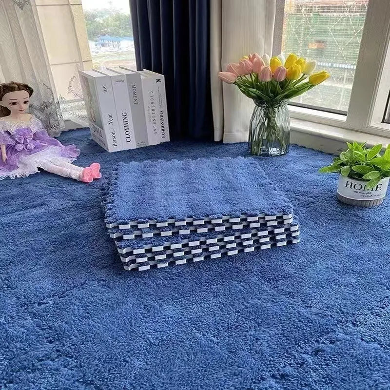 Blue rug with a woven basket, doll, books, and flowers on a blue carpet.