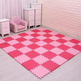 Pink checkered foam mat on a light gray floor with pink furniture in the background.
