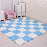 Blue and white checkered foam mats on a wooden floor.