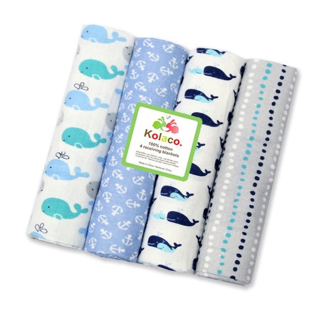 Soft flannel muslin baby blanket set in a nautical whale print, ideal for newborn gifting and seaside stroller trips.