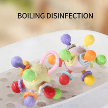 Two grasping balls in a tray with a boiling disinfection note