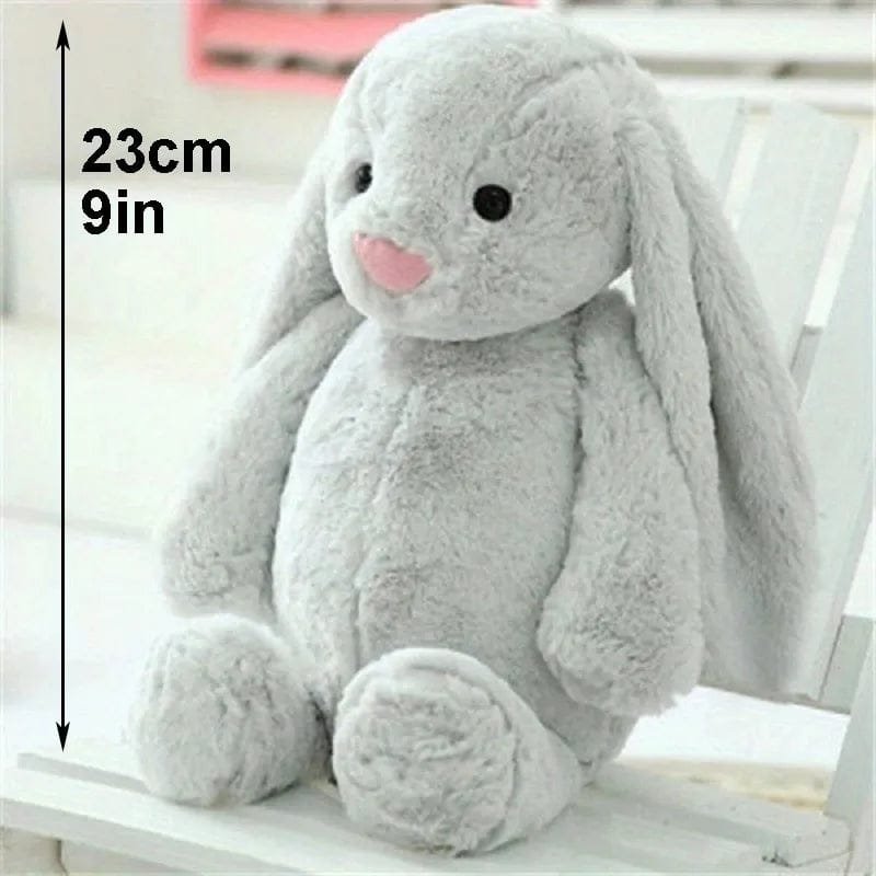 Gray plush bunny toy with measurement label.